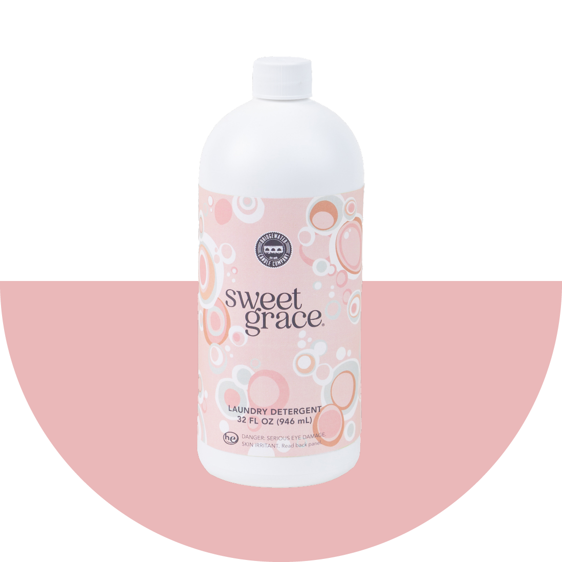 Sweet Grace Laundry Detergent on a pink half circle background