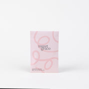 The Sweet Grace Modern Swirl Sachet by Bridgewater Candle Company features a pink minimalist design with light swirls, standing upright on a white background—perfect for adding a stylish, fragrant touch to any room.