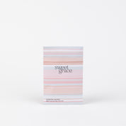 The Sweet Grace Modern Stripe Sachet by Bridgewater Candle Company stands upright on a white background, featuring pastel pink, white, and peach stripes. It infuses your space with the signature Sweet Grace fragrance.