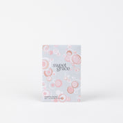 The Sweet Grace Modern Bubble Sachet by Bridgewater Candle Company features pink and white bubble patterns on a light rectangular package, perfect for home fragrance and displayed upright against a plain white backdrop.