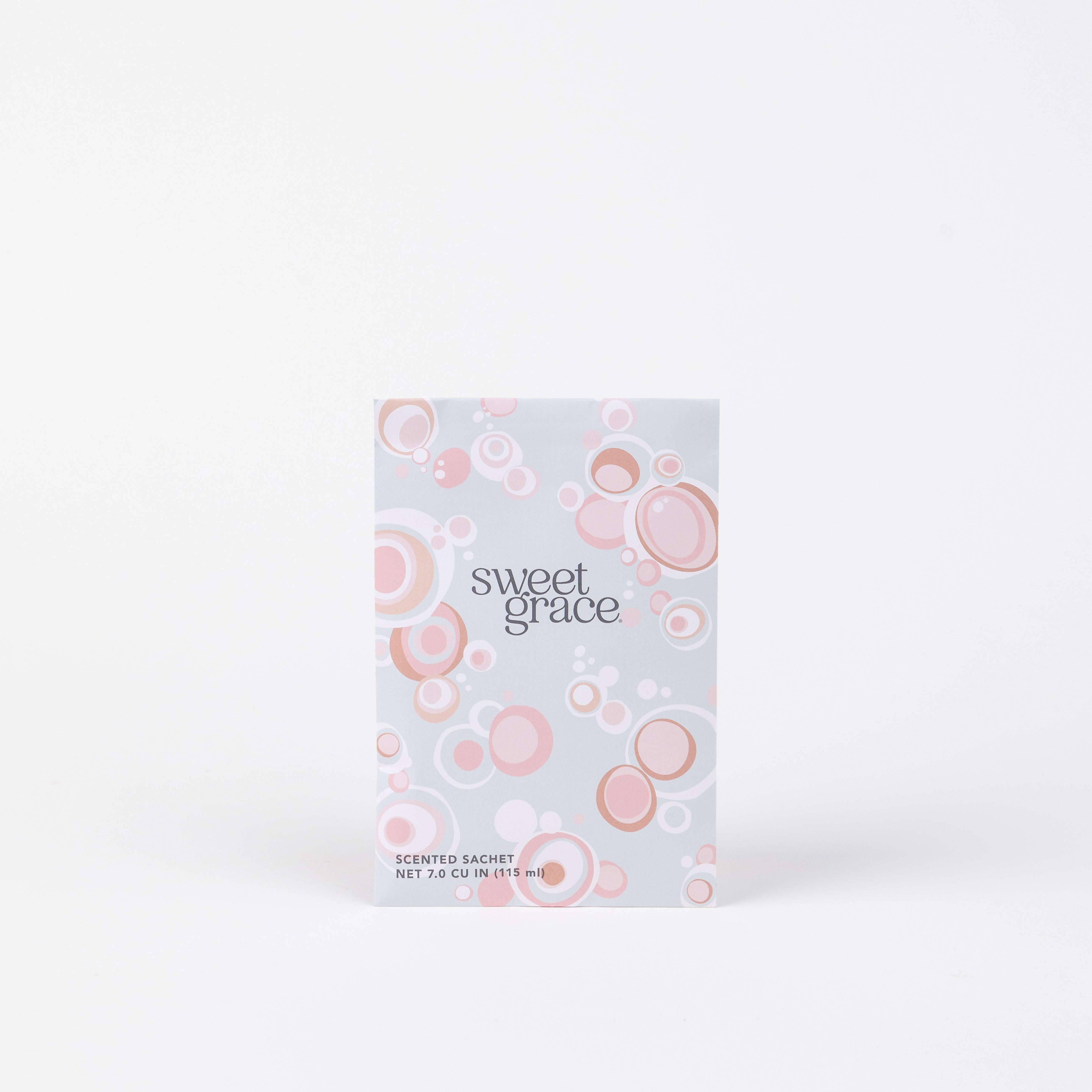 The Sweet Grace Modern Bubble Sachet by Bridgewater Candle Company features pink and white bubble patterns on a light rectangular package, perfect for home fragrance and displayed upright against a plain white backdrop.