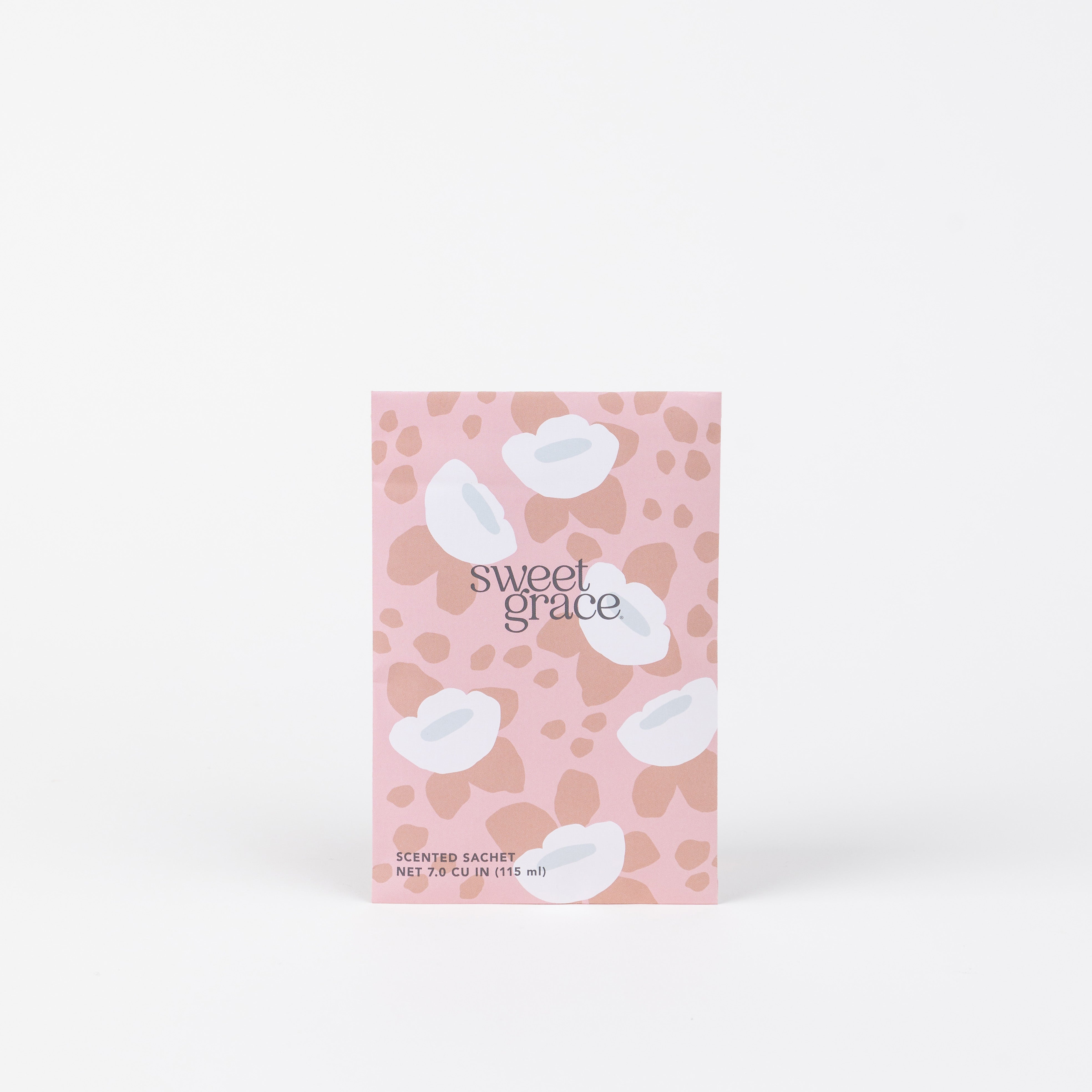 The Sweet Grace Modern Flower Sachet by Bridgewater Candle Company comes in a pink packet with floral and abstract patterns, offering the signature Sweet Grace scent to add a refreshing fragrance to any space.