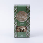 The Bridgewater Candle Company Festive Frasier Holiday Mercury Flower Diffuser (8 fl oz/236 mL) features a green plaid box with a window showing a white flower—ideal for bringing festive holiday decor to your space.