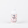 A white bottle from Fast Bundle's Santa's Sweet Grace Bundle, 6 fl oz (177 ml) with a pink and white circular label, stands upright against a plain white background—ideal for fans of scented home products.