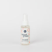 A small spray bottle from Fast Bundle labeled Sweet Grace Stain Remover Bundle with a white and pink circular design, set against a plain white background.