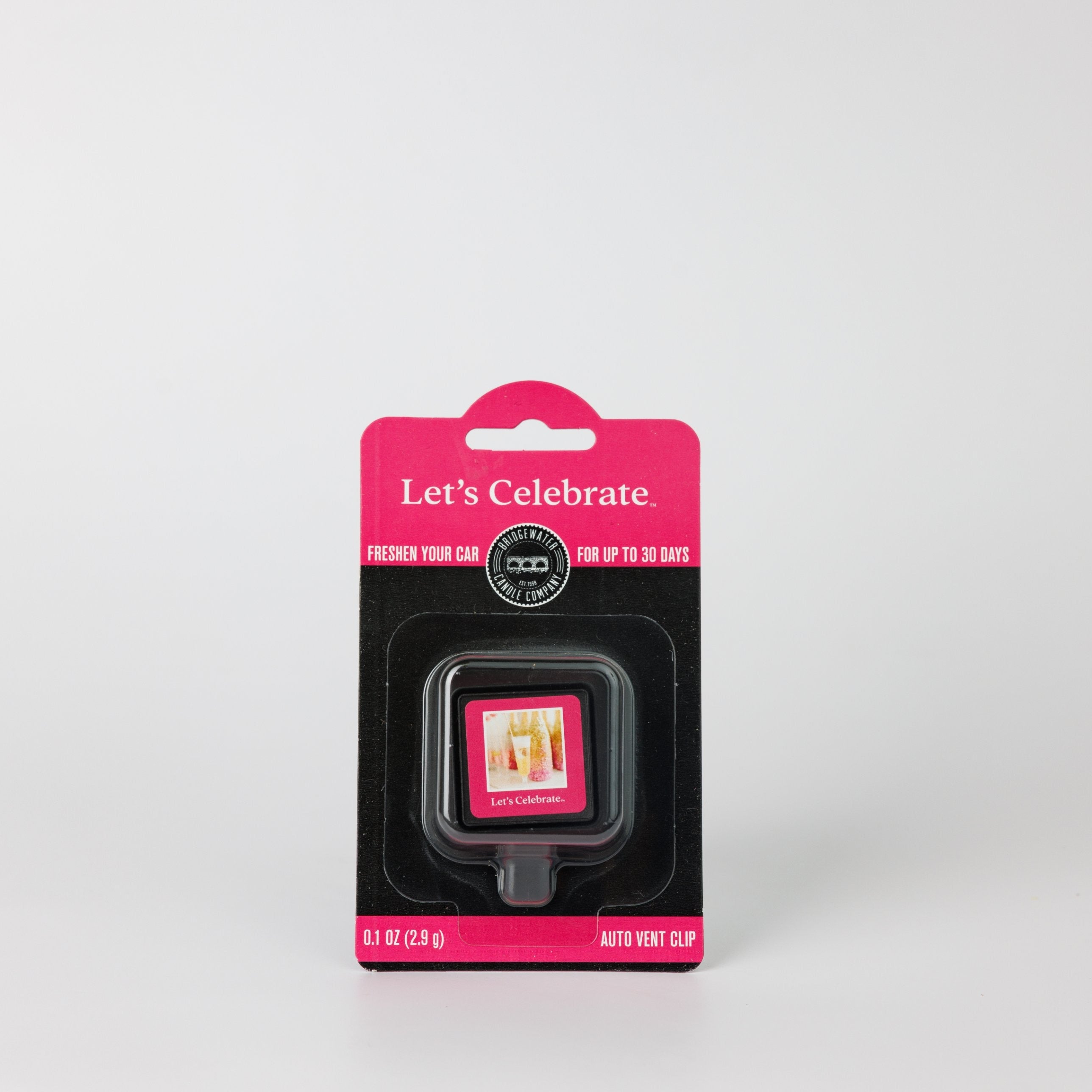 Bridgewater Candle Auto Vent Clip-Let’s Celebrate fragrance air freshener in blister packaging featuring a pink label with text reading Lets Celebrate.