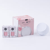 The Bridgewater Candle Company Pura + Bridgewater Sweet Grace Lovers Kit includes a white Pura Smart Home Diffuser and two Sweet Grace fragrance refills in pink and white boxes, all displayed on a light background.