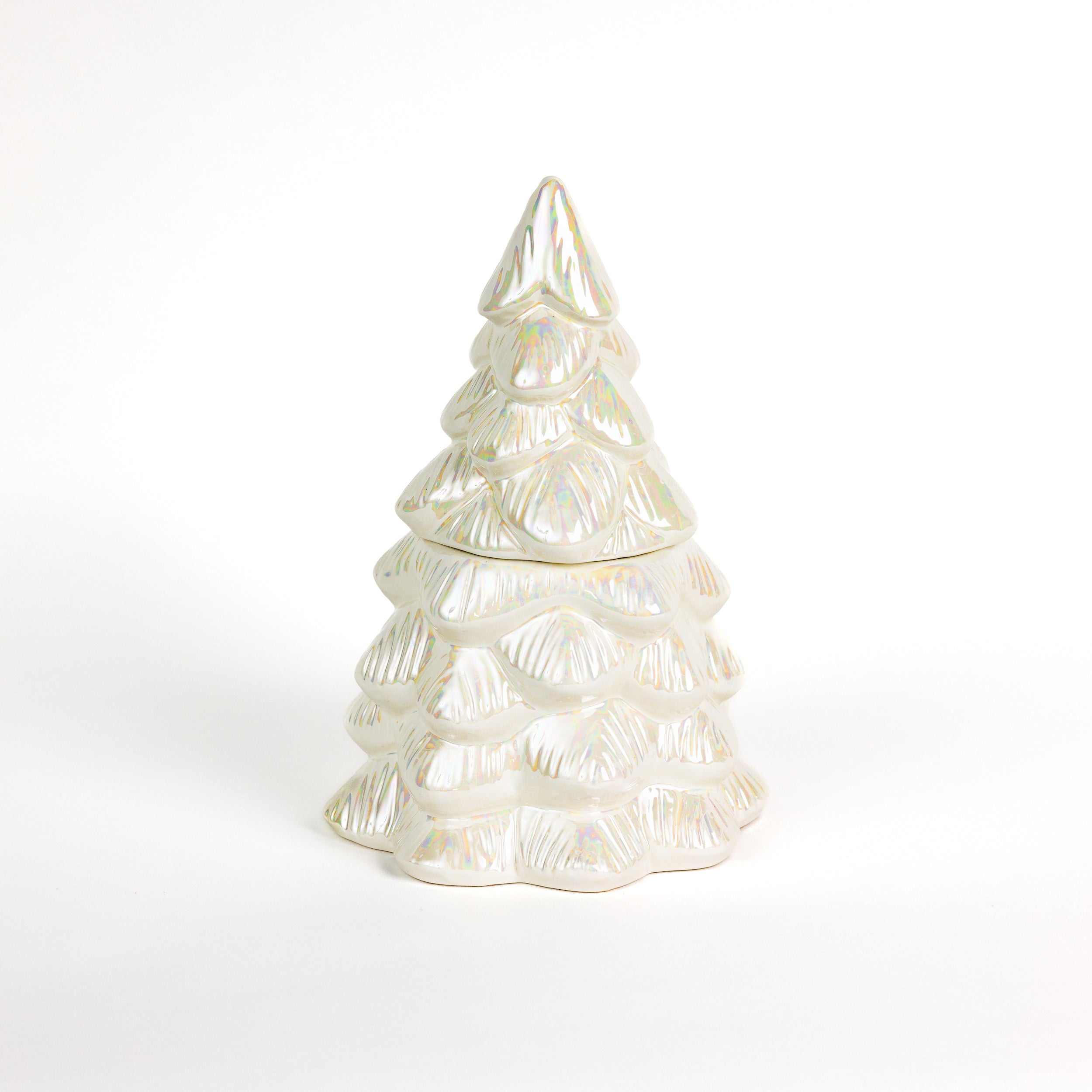 A white, iridescent ceramic Christmas tree figurine rests on a plain white background, making a festive holiday centerpiece—especially when displayed beside the Bridgewater Candle Sweet Grace Collection Candle #70.