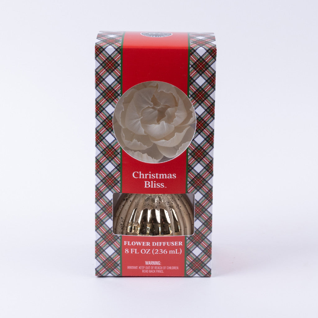 Bridgewater Candle Company's Christmas Bliss Holiday Mercury Flower Diffuser features a white flower atop plaid packaging with festive mercury finish accents, an 8 fl oz (236 mL) box, and a window to view the diffuser.