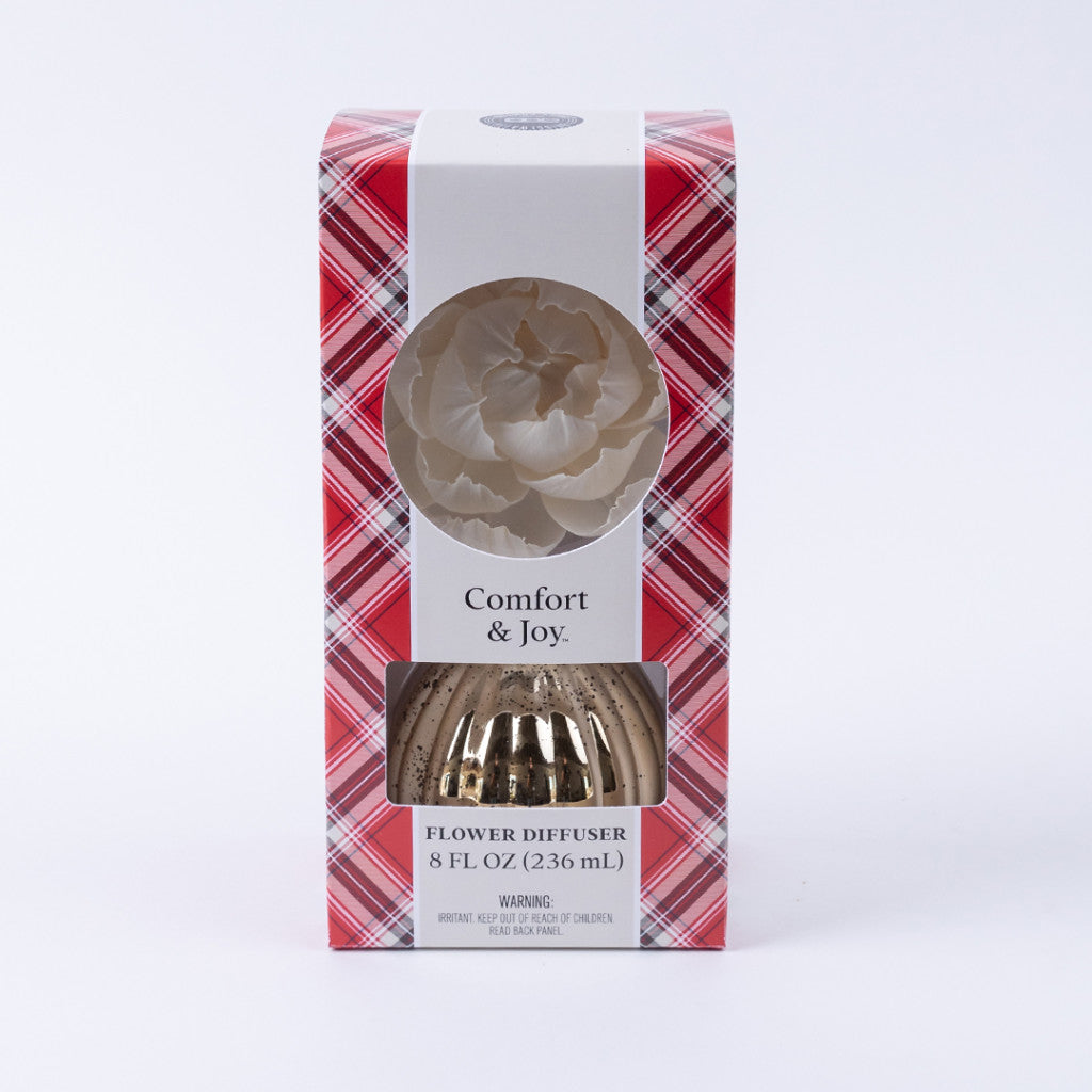 The Bridgewater Candle Company Comfort & Joy Holiday Mercury Flower Diffuser features a red plaid box, white flower top, and gold mercury-finish bottle visible through a clear window.