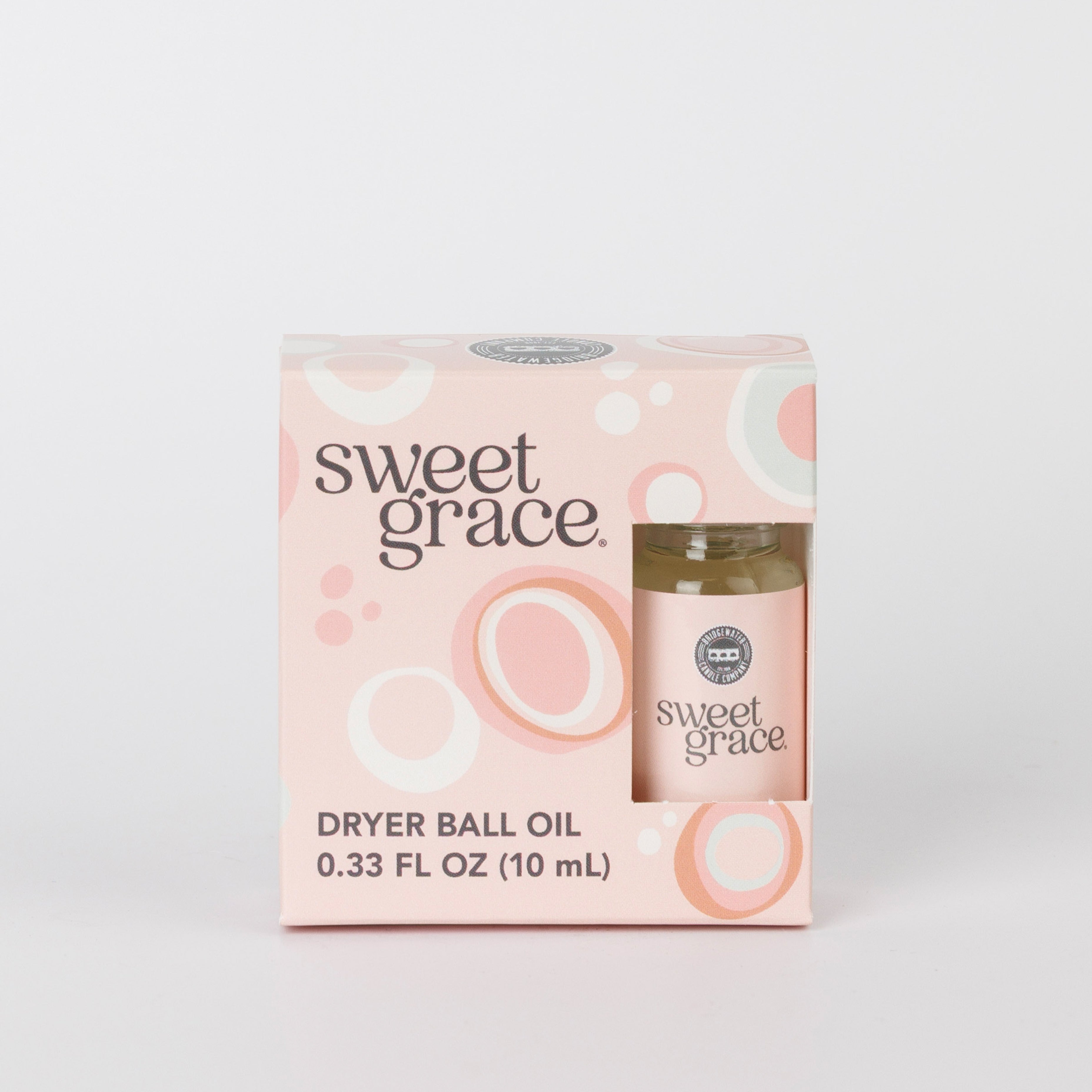 A 0.33 fl oz (10 mL) box of Bridgewater Candle Sweet Grace Dryer Ball Refill features a pink and peach circular design with a visible bottle—ideal for adding fragrance to your wool dryer balls.