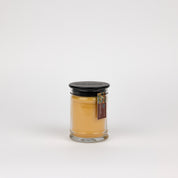 The Bridgewater Candle Autumn Gold Small Jar Candle features soy-blend wax, a black lid, and brown label, all set against a plain white background.