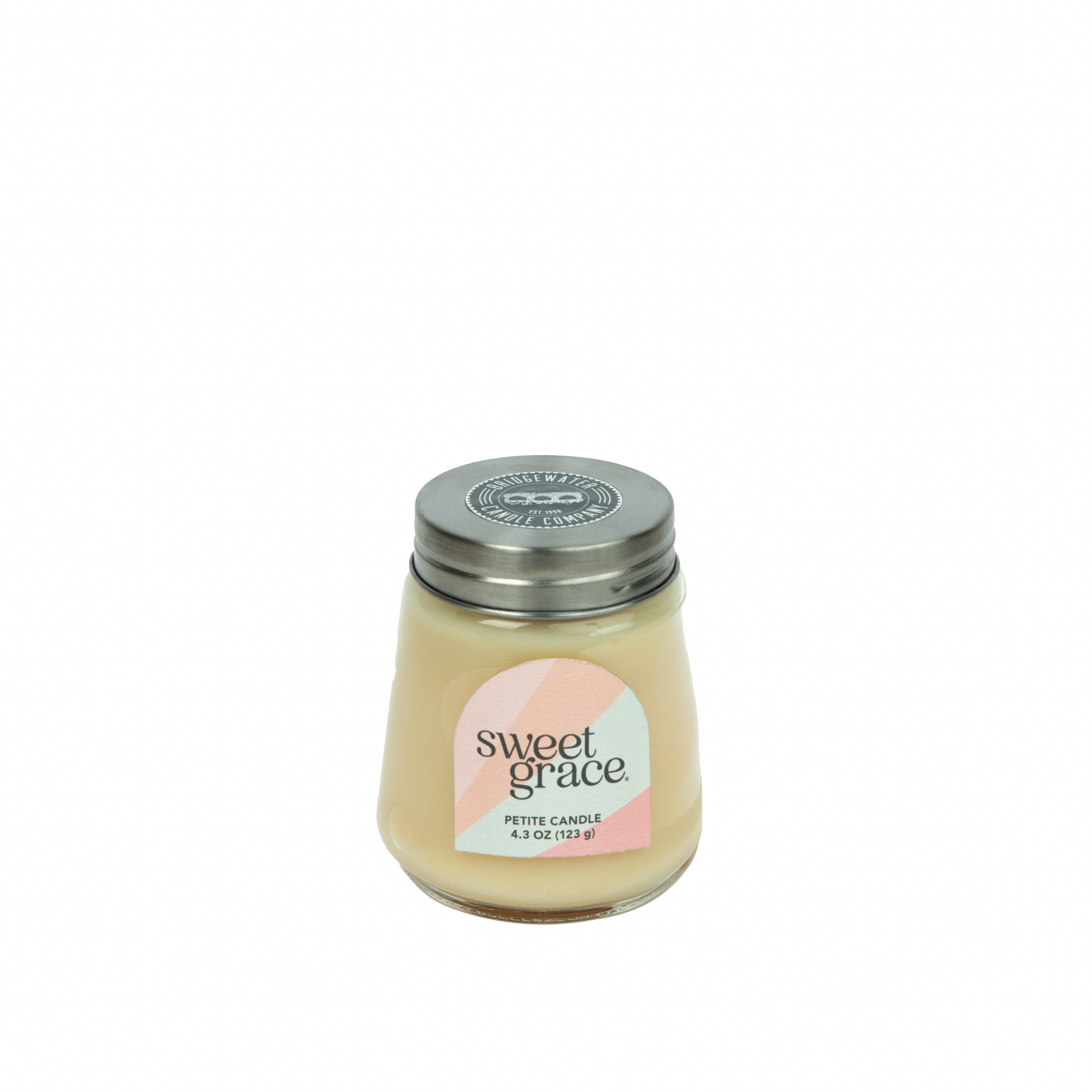 A petite 3.5 oz (99g) Sweet Grace Collection Candle #078 by Bridgewater Candle in a glass jar with silver lid. The pastel geometric label and light beige soy-blend wax add a stylish touch.