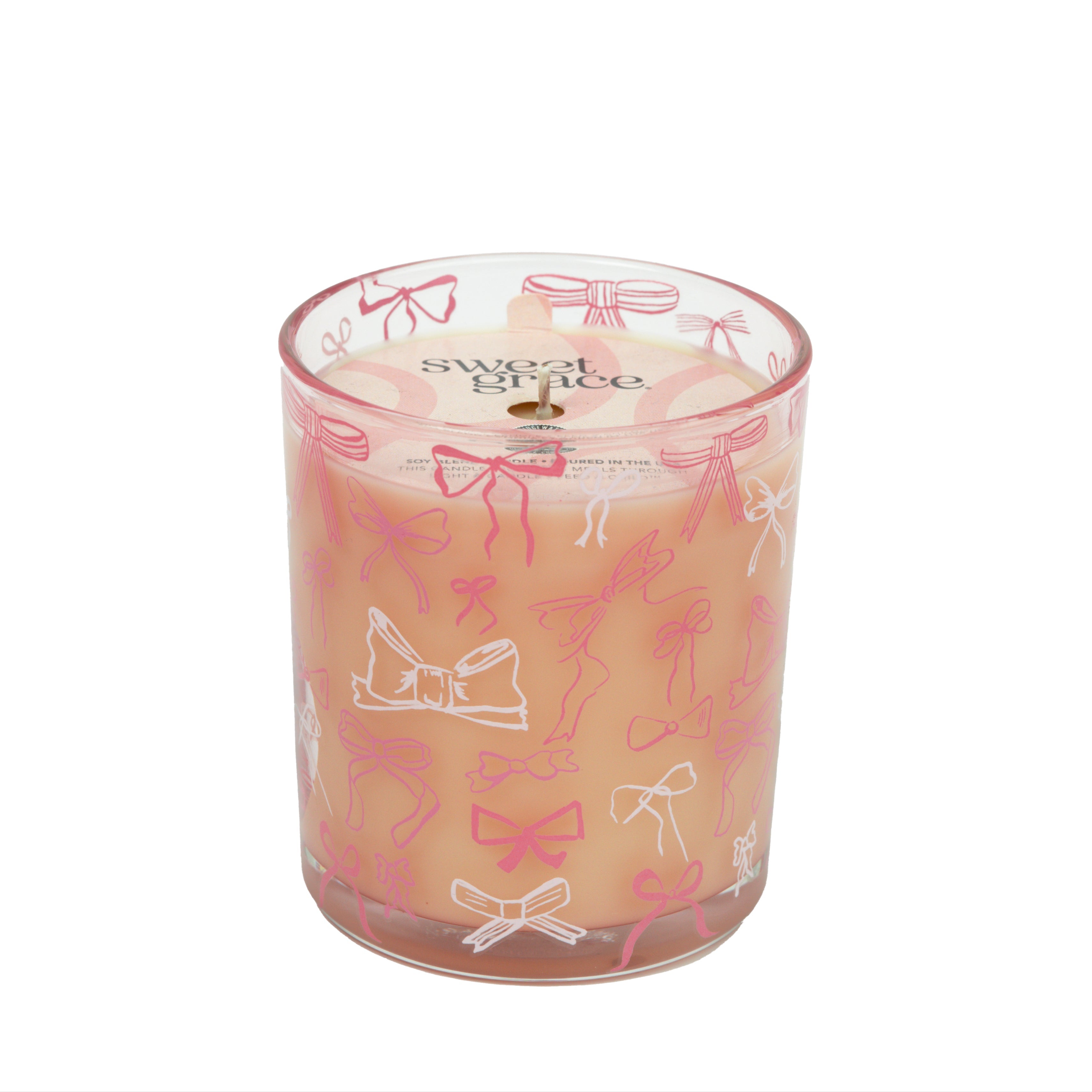 The Bridgewater Candle Sweet Grace Pink Bow Candle features soy-blend wax in a glass jar decorated with pink and white bows. The label displays "Sweet Grace" against a plain white background.