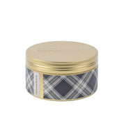 Bridgewater Candle Companys Afternoon Retreat 3-Wick Tin Candle comes in a round metal tin with a gold lid and blue, gray, and white plaid sides. The soy-blend wax ensures a clean burn, perfect for an inviting Afternoon Retreat atmosphere.