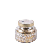 The Bridgewater Candle Company Sweet Grace Mercury Jar Candle features a round jar with a gold lid and metallic gold and white speckles. Made from soy-blend wax, it is displayed against a plain white background.