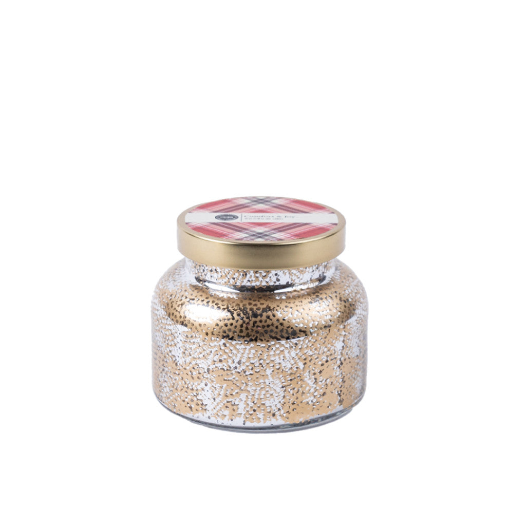 The Comfort & Joy Holiday Mercury Jar Candle by Bridgewater Candle Company features a glass soy-blend wax jar with a gold lid, gold and white speckled design, and a plaid label on the lid, set against a plain white background.