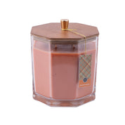 The Bridgewater Candle Company Harvest Pumpkin Holiday Large Decorative Candle features peach-colored soy-blend wax, a wooden hexagonal lid with a gold knob, and a plaid Harvest Pumpkin tag hanging from the lid by a gold string.