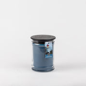 The Bridgewater Candle Company Nantucket Coast 8oz Jar Candle sits in clear glass with a black lid and lighthouse tag, evoking coastal serenity—all photographed on a plain white background.