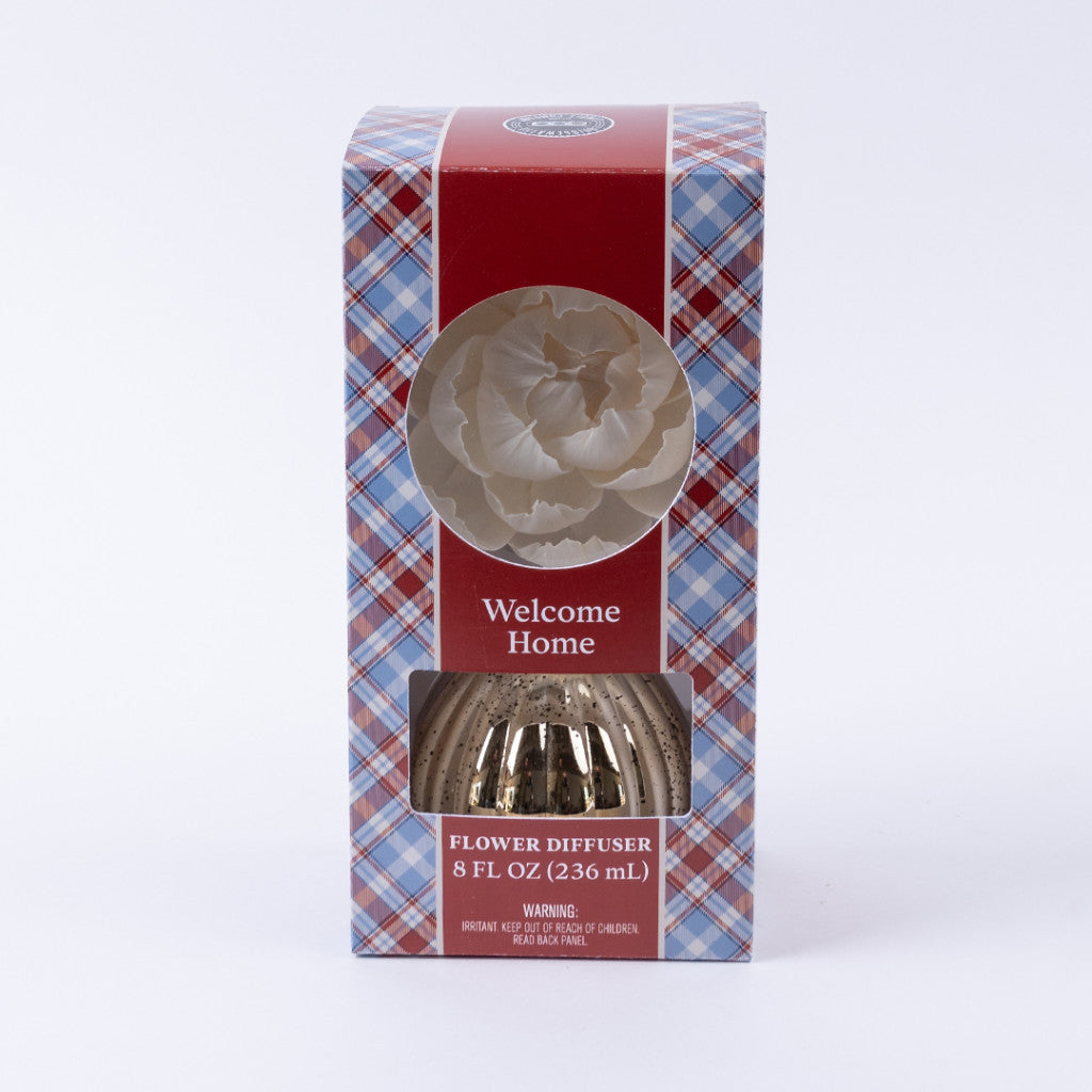 The Welcome Home Mercury Flower Diffuser by Bridgewater Candle Company comes boxed in red, blue, and white plaid. It holds 8 fl oz (236 ml) and displays a white artificial flower through a window—ideal for home fragrance.