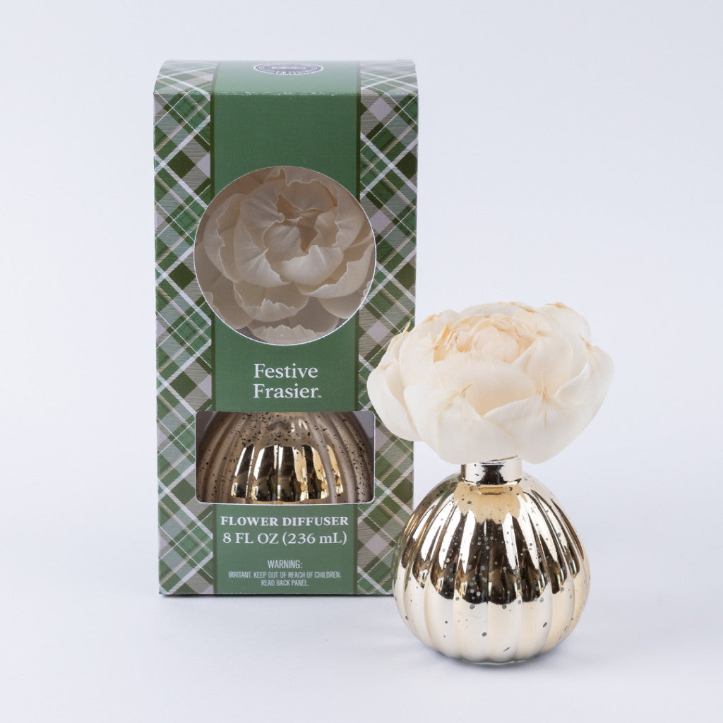 The Bridgewater Candle Company Festive Frasier Holiday Mercury Flower Diffuser features a cream artificial flower in a gold ribbed vase, ideal for holiday décor, and comes in green plaid packaging labeled "Flower Diffuser 8 Fl Oz (236 mL).