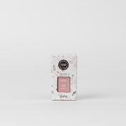 A white rectangular box of Bridgewater Candle Company’s Pura + Bridgewater Fragrance Refill in Sweet Grace stands against a plain background, showcasing a pink and gray pattern with black and pink labels; compatible with Pura Smart Vials.