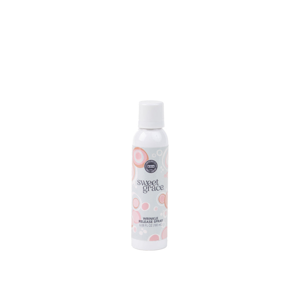 The Bridgewater Candle Company Sweet Grace Wrinkle Release Spray comes in a white bottle with a white cap and features pink and gray circles—ideal as a clothes spray to refresh fabrics, shown against a plain white background.