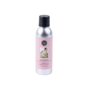 A silver non-aerosol spray can with a black cap and pink Spring Dress label featuring a dress image—Bridgewater Candle Company’s eco-friendly room spray is a premium home fragrance for any room.