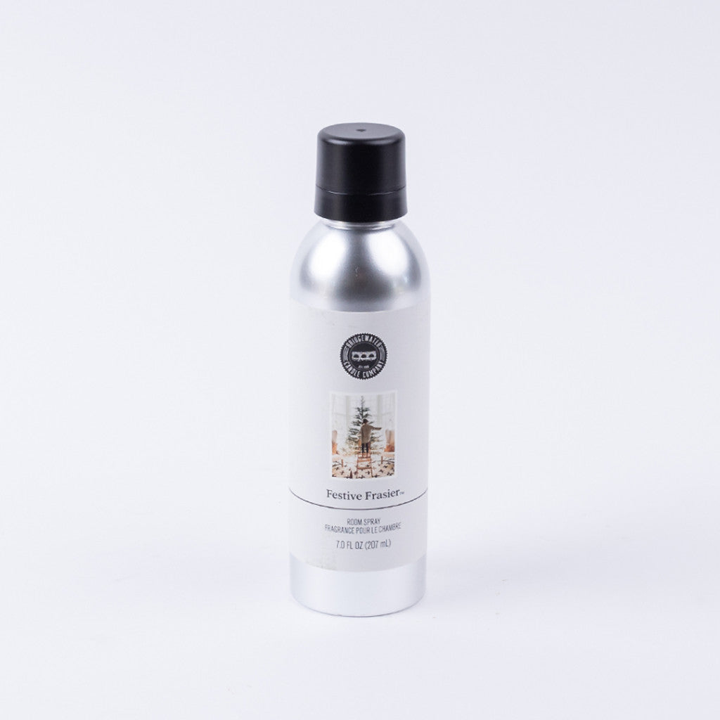 A silver can of Bridgewater Candle Company’s Festive Frasier Non-Aerosol Room Spray with a black cap and Christmas tree label sits on a white background—an eco-friendly way to add festive fragrance to your home.