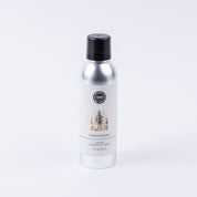 A silver can of Bridgewater Candle Company’s Festive Frasier Non-Aerosol Room Spray with a black cap and Christmas tree label sits on a white background—an eco-friendly way to add festive fragrance to your home.