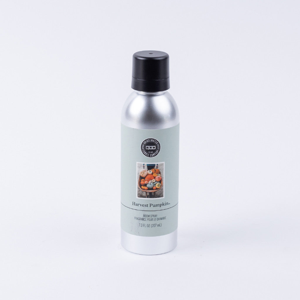 A silver Harvest Pumpkin Non-Aerosol Room Spray by Bridgewater Candle Company stands upright on a plain white background. The black-capped, eco-friendly bottle features small pumpkins in a basket on the label.