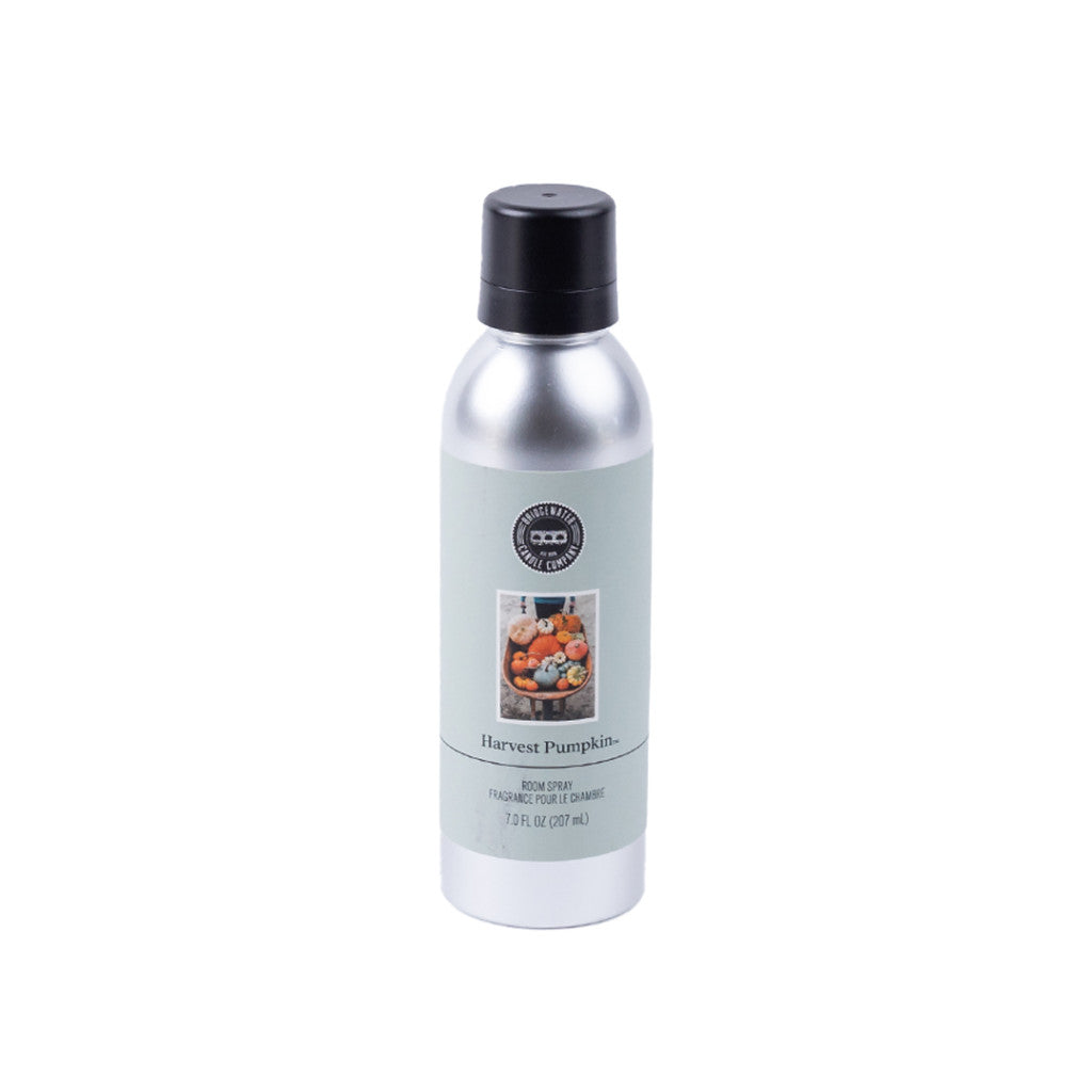 Bridgewater Candle Companys Harvest Pumpkin Non-Aerosol Room Spray comes in a silver bottle with a black cap and pale green label, filling your room with the cozy autumn scent of pumpkins. Eco-friendly and perfect for fall ambiance.