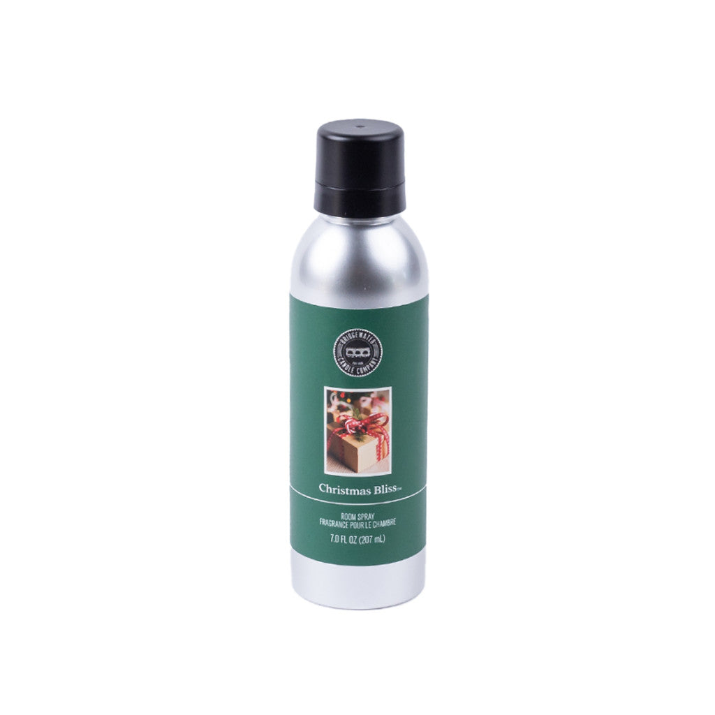 A silver can of Bridgewater Candle Company’s Christmas Bliss Non-Aerosol Room Spray with a green holiday-themed label and black cap; contains 7 oz (207 ml) of eco-friendly fragrance, shown against a white background.