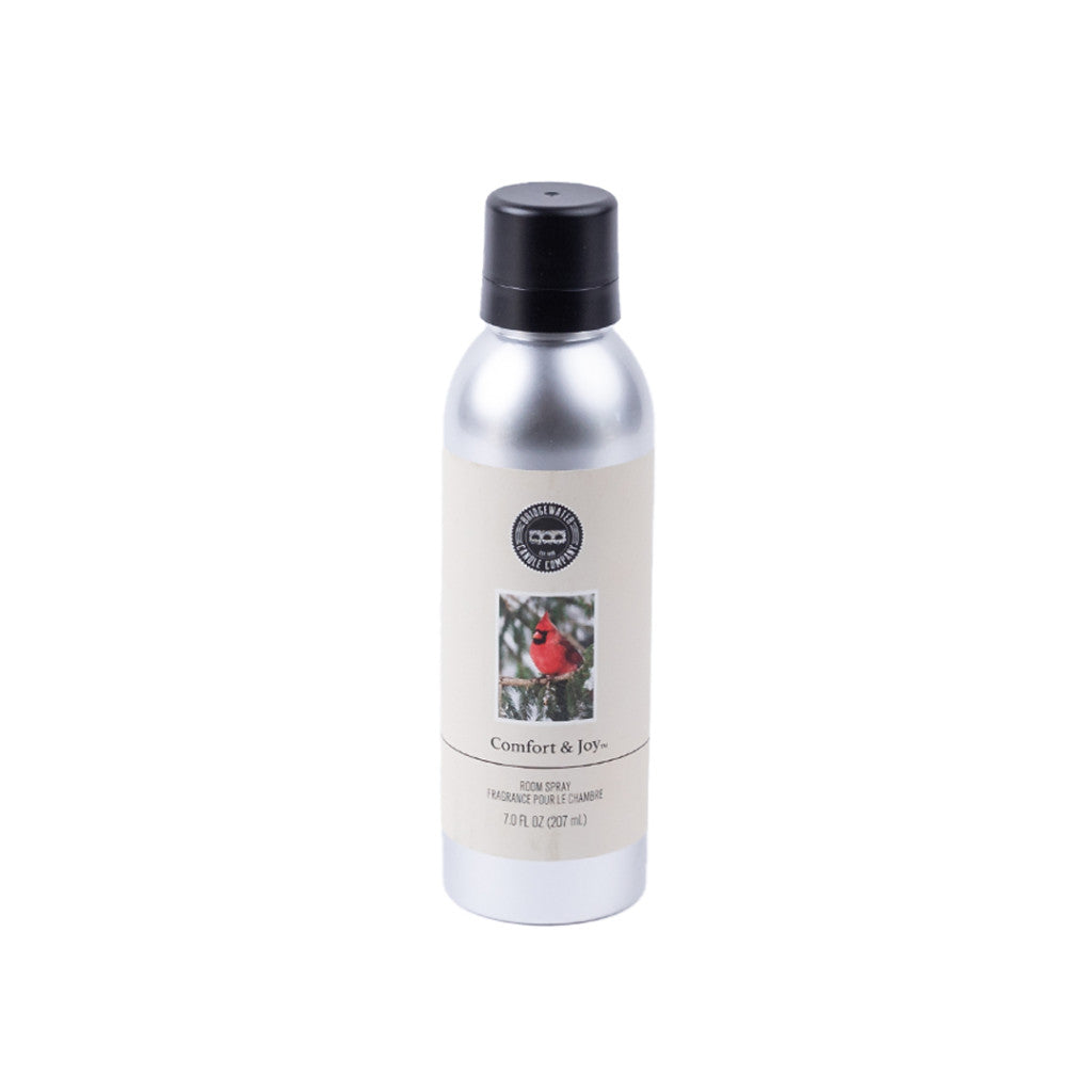 Bridgewater Candle Company’s Comfort & Joy Non-Aerosol Room Spray comes in a 7oz silver can with a black cap and features a label adorned with a red cardinal on a branch. Eco-friendly design for freshening your home.