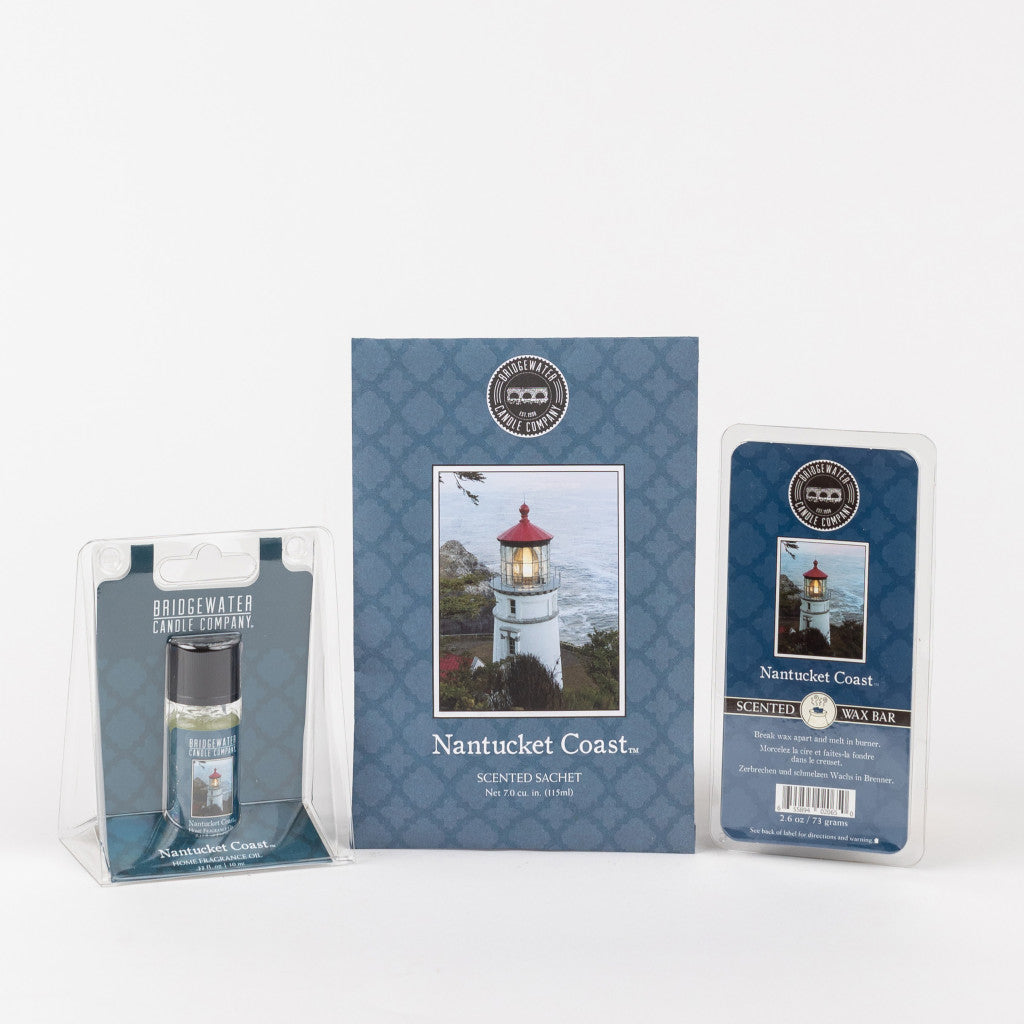The Bridgewater Candle Company Nantucket Coast Flameless Bundle is displayed, featuring a matching blue and white home fragrance oil bottle, sachet with lighthouse image, and soy-blend wax bar package.