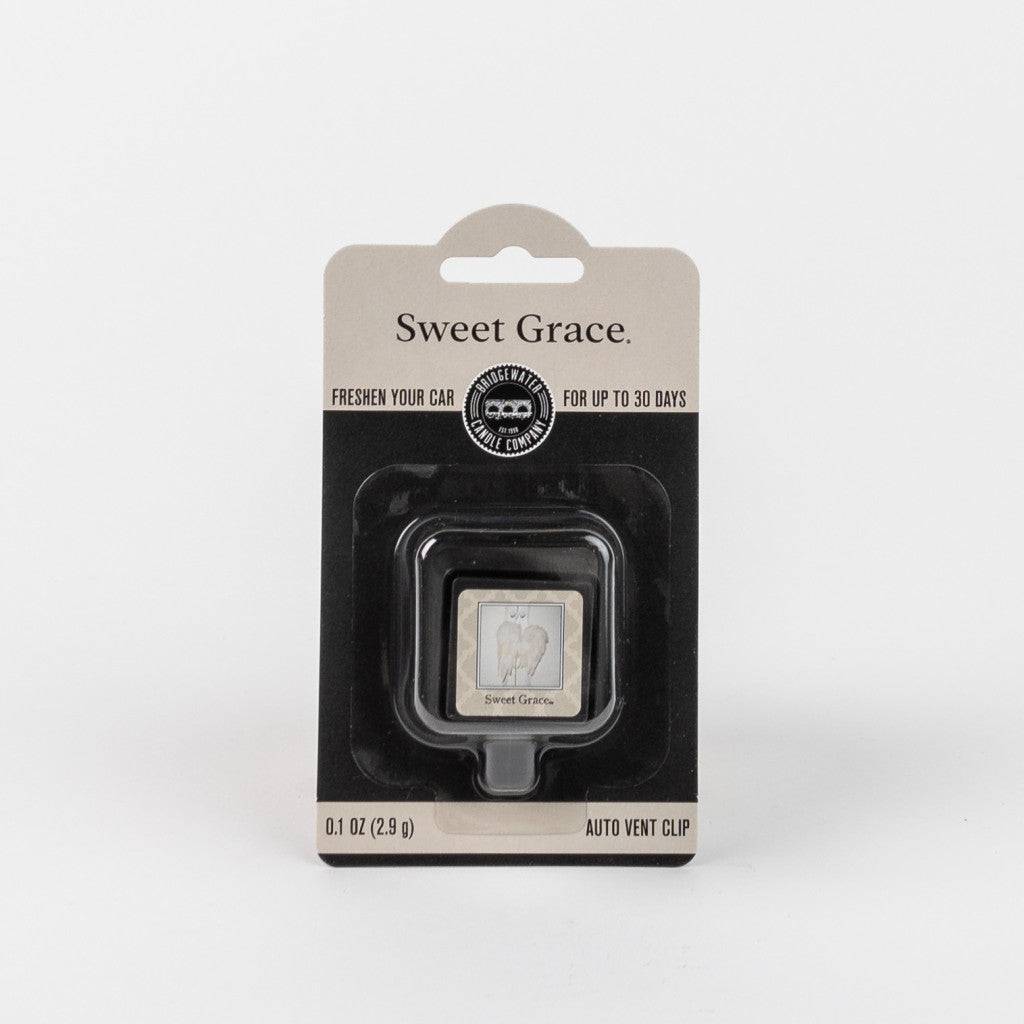 A packaged Bridgewater Candle Company Sweet Grace Auto Vent Clip car air freshener is shown against a white background, with sleek black packaging, white text, and a small window highlighting the stylish fragrance product inside.