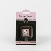 The Bridgewater Candle Company Spring Dress Auto Vent Clip, in a pink and black blister pack with a floral design, offers up to 30 days of fresh fragrance for your car. Net weight: 0.1 oz (2.9 g).
