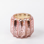 The Bridgewater Candle Company Sweet Grace Collection Candle #021 features a faceted rose gold mercury glass container with a textured, reflective surface, crafted from soy-blend wax and set against a plain white background.