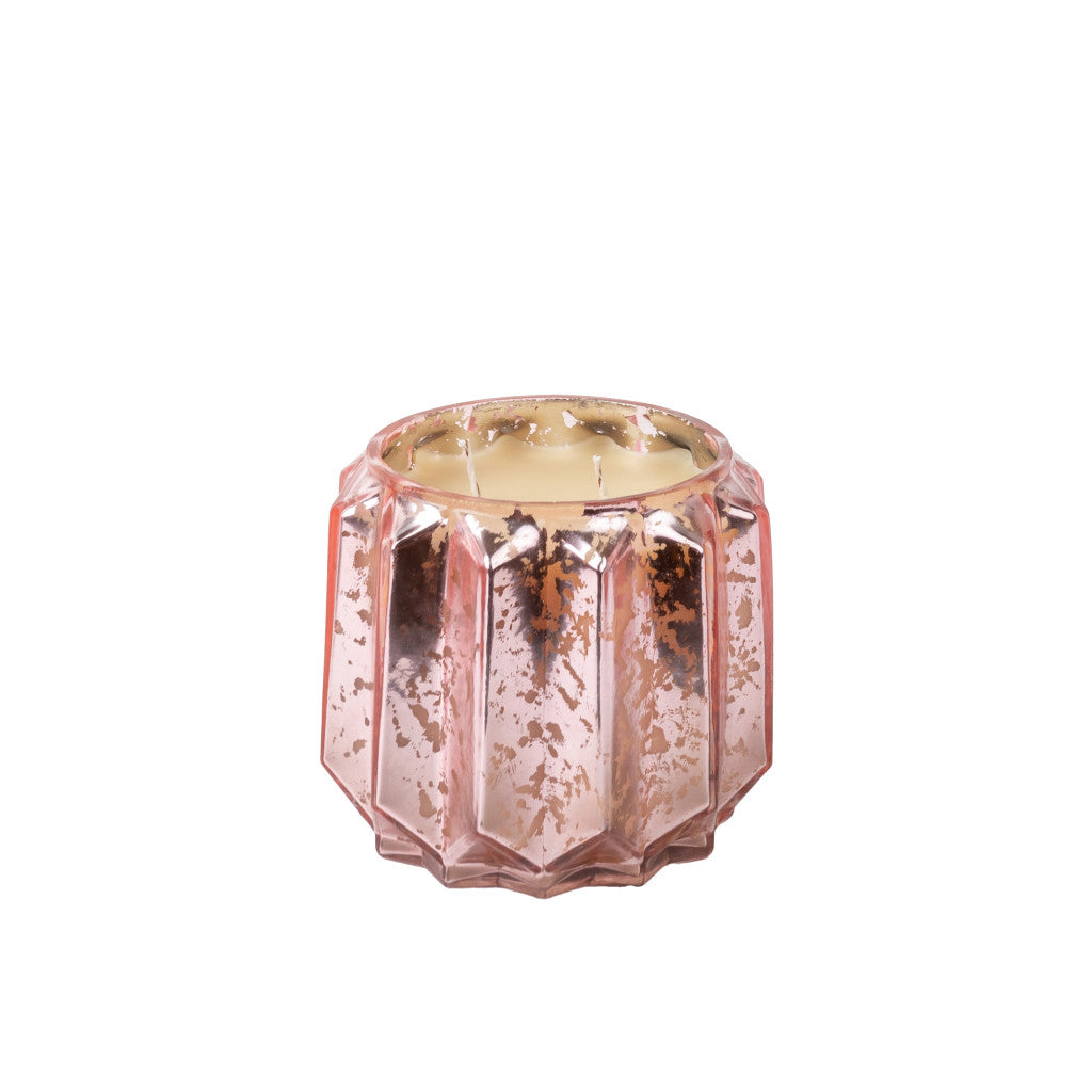 The Bridgewater Candle Company Sweet Grace Collection Candle #021 features a pink faceted glass holder with a rose gold mercury finish, holding an unlit cream soy-blend triple-wick candle.