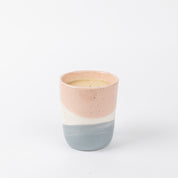 The Bridgewater Candle Company Sweet Grace Collection Candle #041 is a ceramic holder with pink, white, and light blue blocks, featuring a single-wick soy-blend candle in the best-selling Sweet Grace scent against a white background.