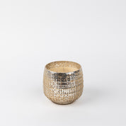 The Bridgewater Candle Company Sweet Grace Collection Candle #051 features a decorative, textured metallic holder in gold and silver with soy-blend wax, shown against a plain white background.