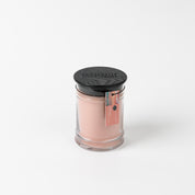 A Bridgewater Candle Sunkissed 8oz Jar Candle with light pink soy-blend wax, black lid, and a pink and green tag is shown on a white background.