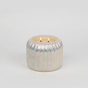 The Bridgewater Candle Sweet Grace Collection Candle #071—a cream-colored, soy-blend candle with two wicks—sits in a round, pearlescent holder with vertical grooves, displayed against a plain white background.