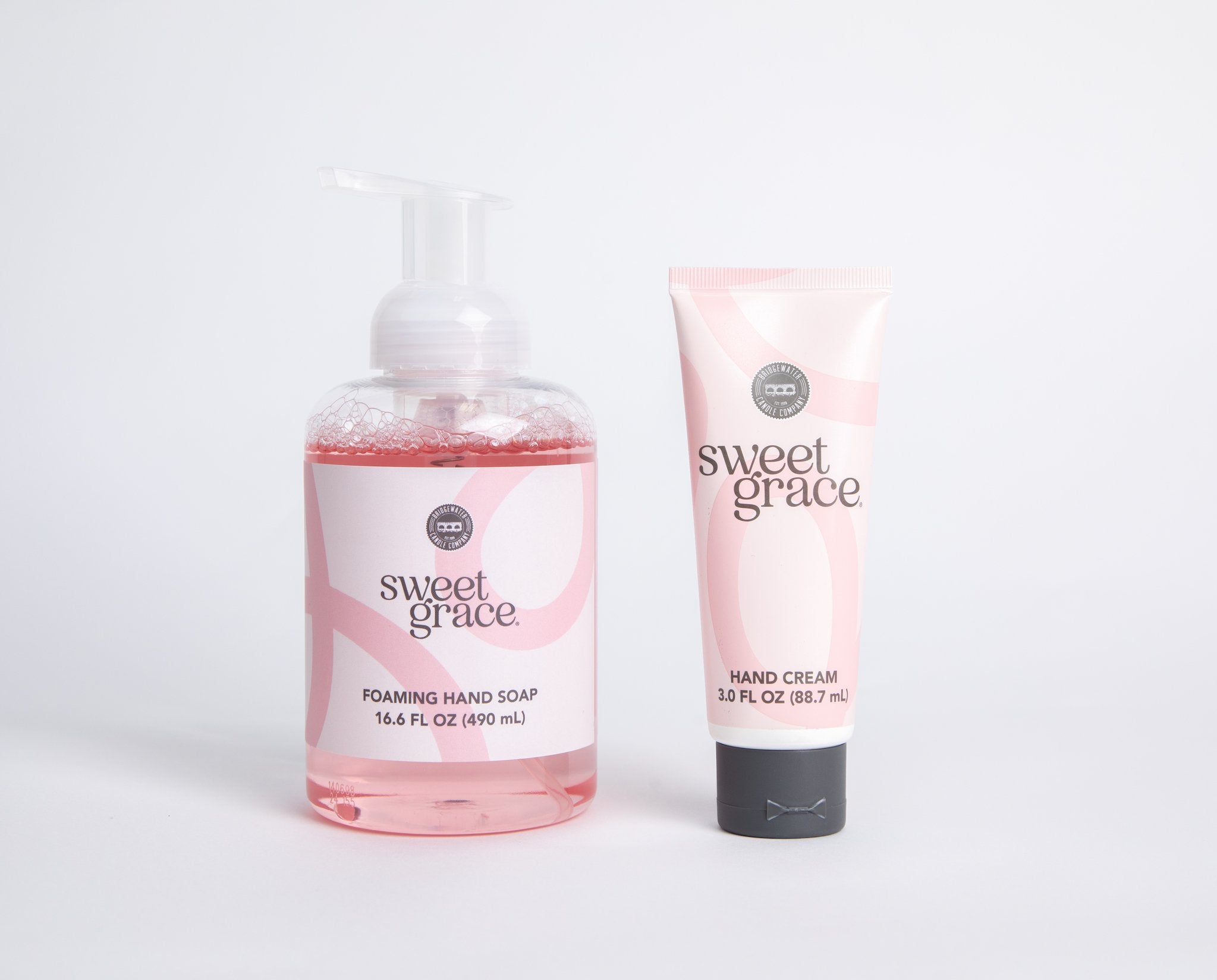 The Sweet Grace Foam & Pamper Bundle, featuring foaming hand soap and a matching hand cream, is displayed side by side on a white background.