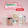 A display of Fast Bundle’s Santa's Sweet Grace Bundle, featuring a candle, flower diffuser, room spray, scented sachet, and laundry detergent, beautifully arranged against a pink background.