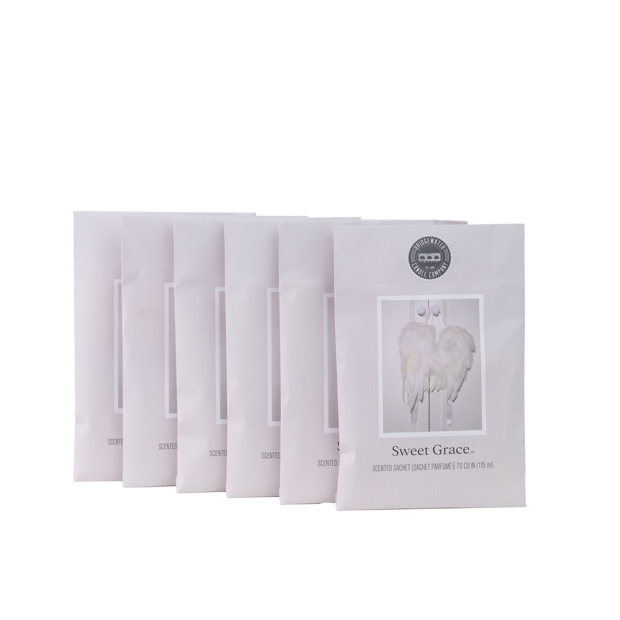 The Sweet Grace Sachet Bundle features six white sachets in a staggered row, each with delicate angel wings on the front, all set against a plain white background.