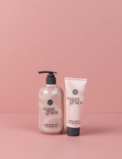 The Sweet Grace On Hand Bundle—featuring Hand Cream and Liquid Hand Soap—stands side by side on a light pink surface with a matching background, perfect for elevating your handcare routine.