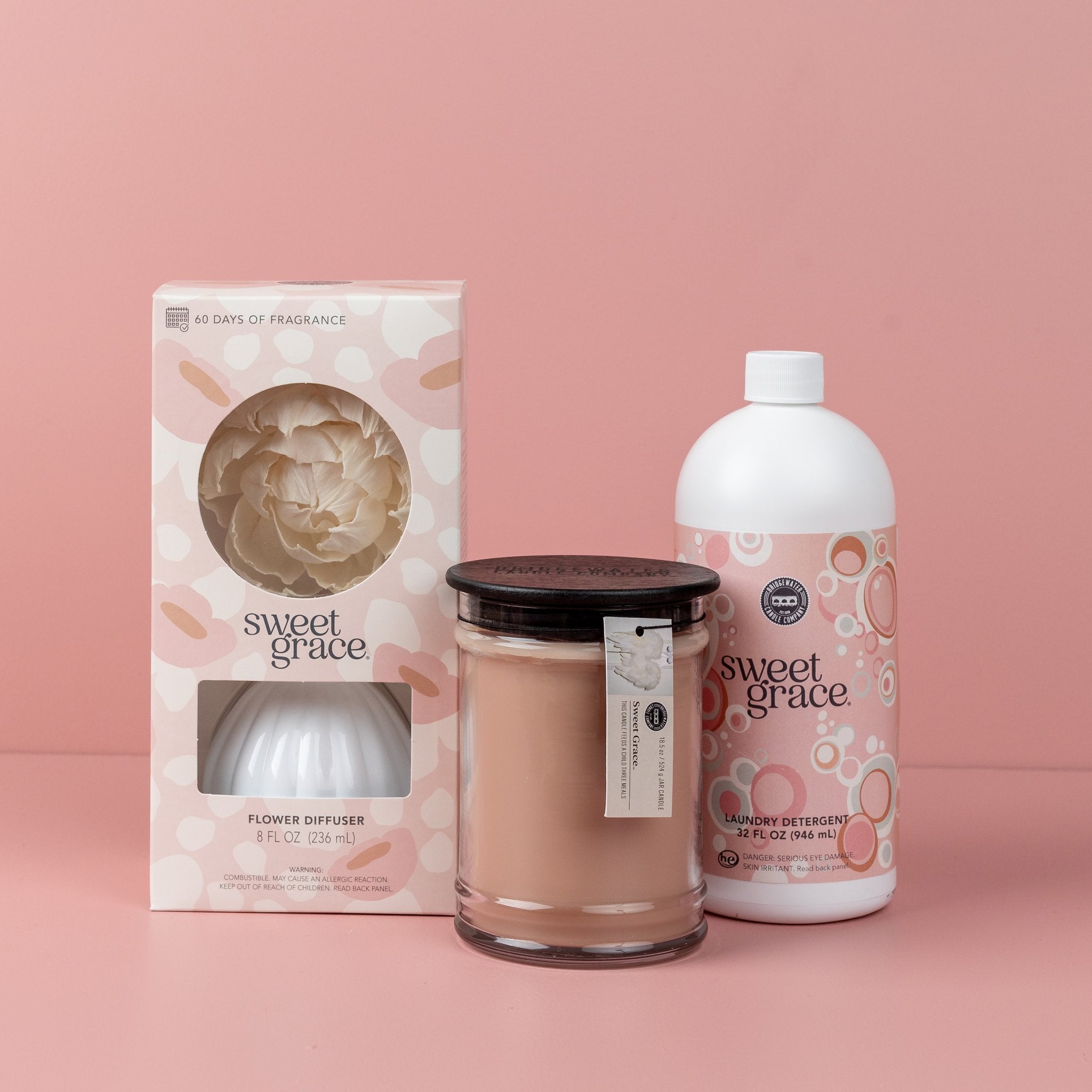 The Sweet Grace Best Sellers Bundle features three favorites—a flower diffuser, large jar candle, and laundry detergent—against a pink background.