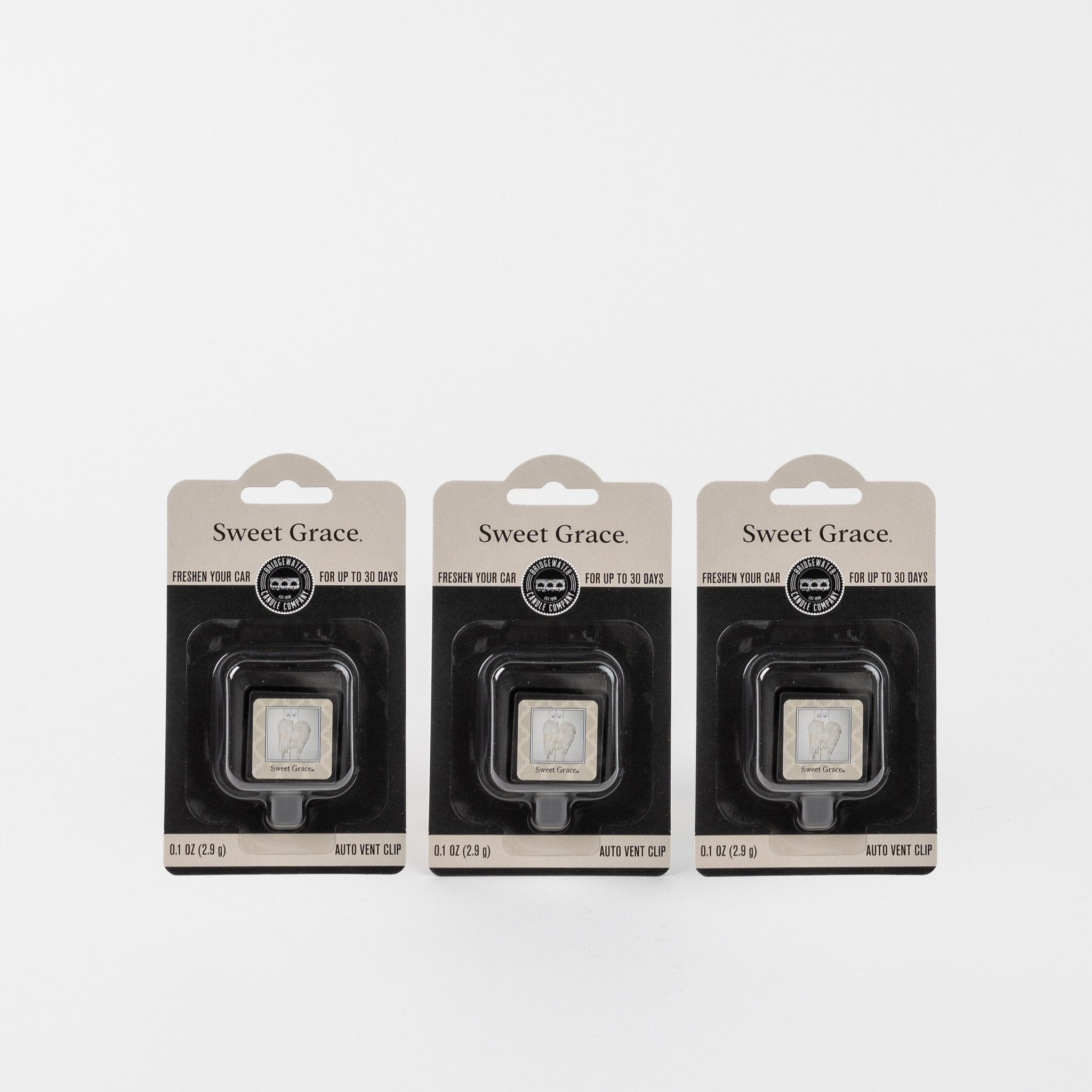 The Three Sweet Grace Auto Vent Clip 3-pack Bundle is displayed side by side in black packaging against a white background, each featuring the car air freshener and highlighting the signature fragrance.