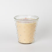 The Bridgewater Candle Sweet Grace Collection Candle #080 features a cream hue in a clear hobnail glass jar with raised dots, displayed against a plain white background.